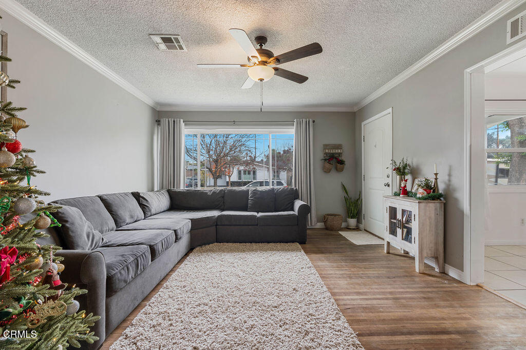 719 North Bradish Avenue San Dimas, CA 91773 - Photo 4 of 22 a living room with furniture and a large window