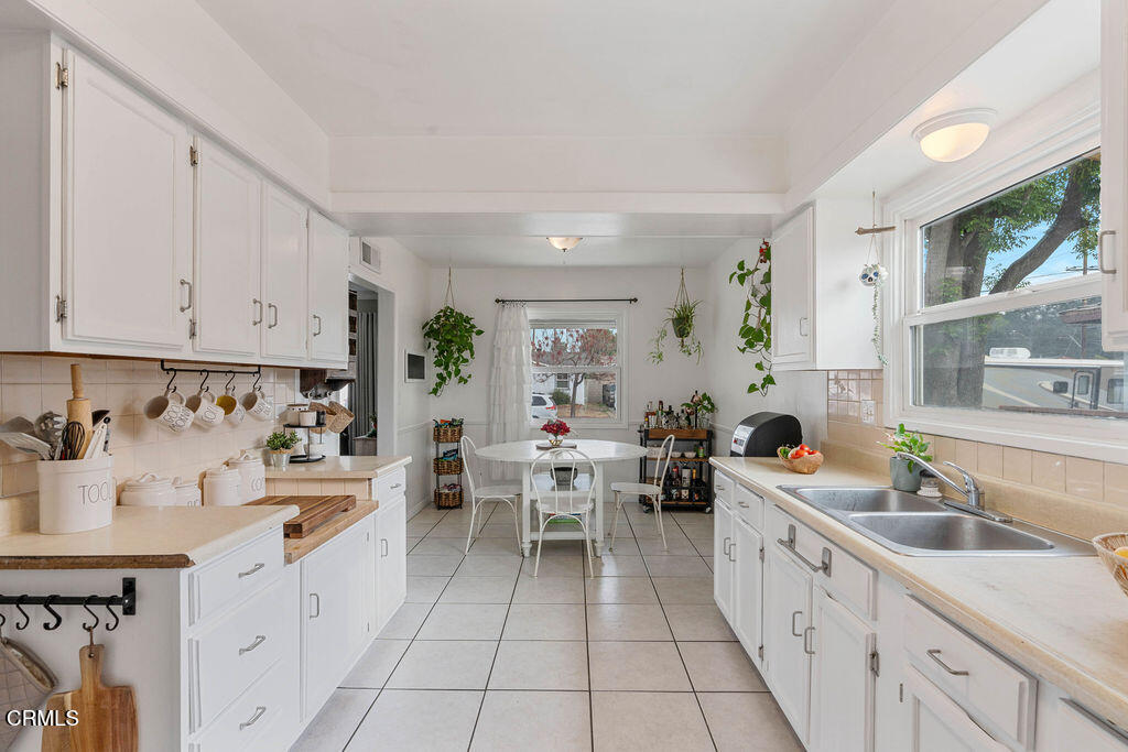 719 North Bradish Avenue San Dimas, CA 91773 - Photo 6 of 22 a kitchen with cabinets a sink and appliances