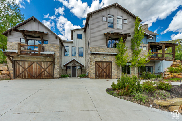 1685 North 300 East Midway, UT 84049 - Photo 1 of 1 View of front facade with board and batten siding, a balcony, and stone siding