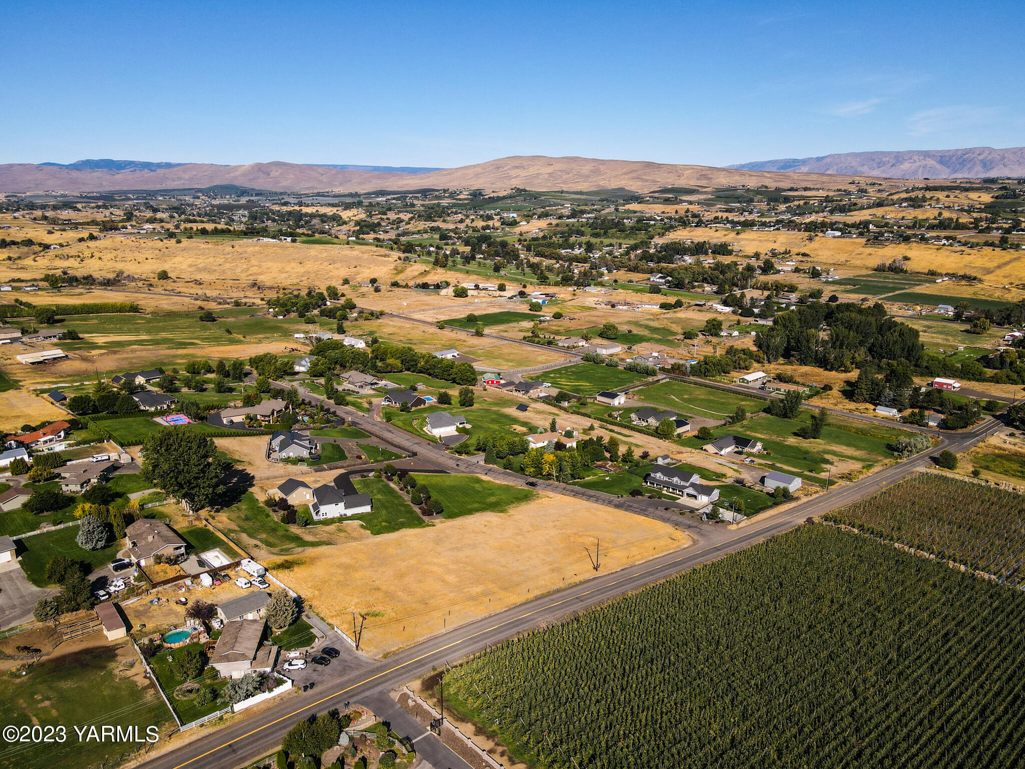 11200 Flintstone Road Yakima, WA 98908 - Photo 2 of 10 an aerial view of residential houses with outdoor space