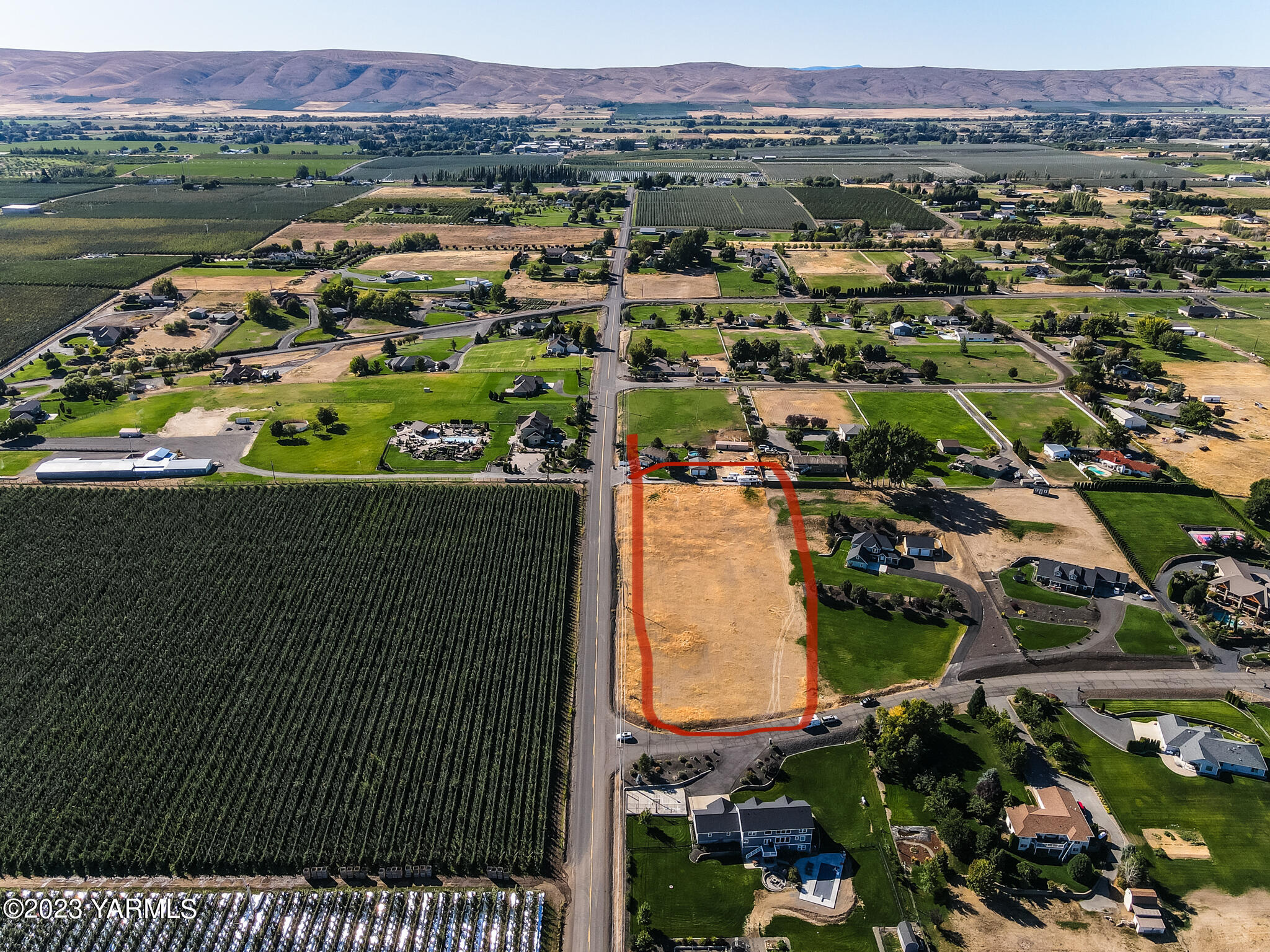 11200 Flintstone Road Yakima, WA 98908 - Photo 8 of 10 an aerial view of residential houses with outdoor space