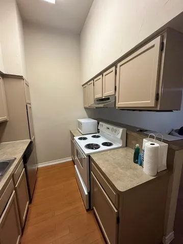 a kitchen with a stove and a microwave