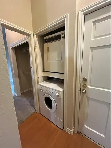 an entryway with wooden floor