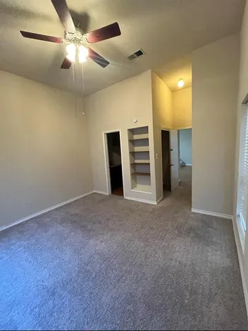 a view of a livingroom with a ceiling fan