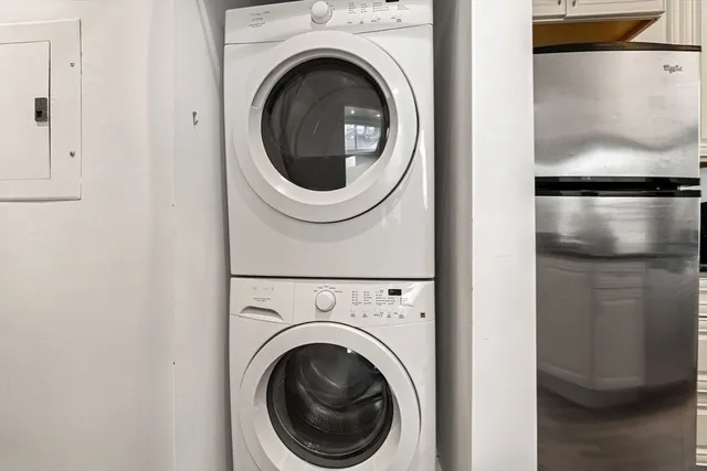 a view of a hallway with washer and dryer