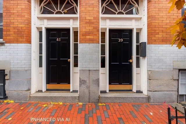 a view of front door of house with wooden floor