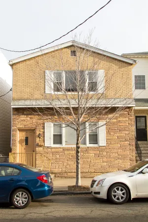 a car parked in front of a house
