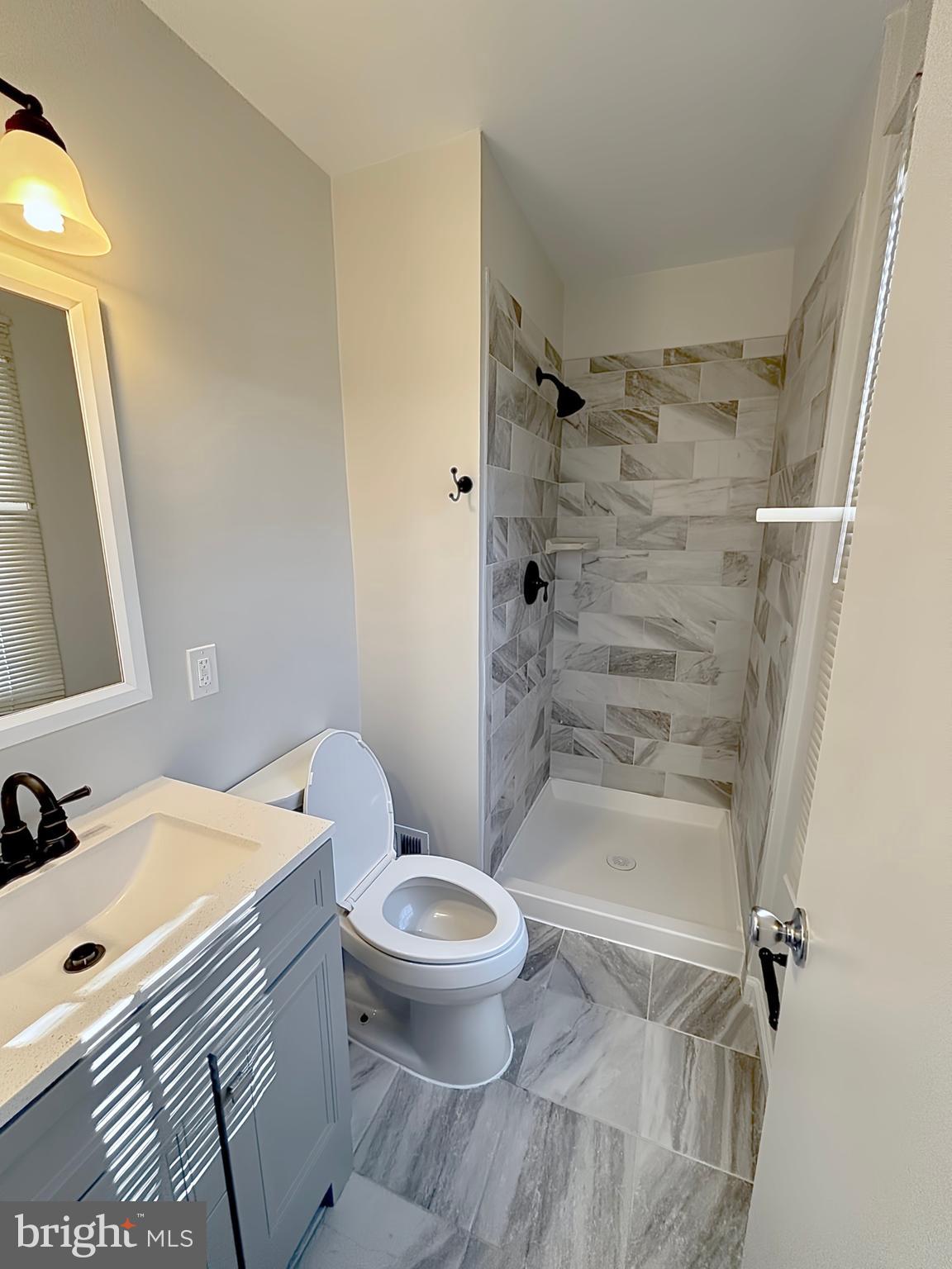 9278 Taney Road Manassas, VA 20110 - Photo 28 of 34 a bathroom with a sink toilet and shower