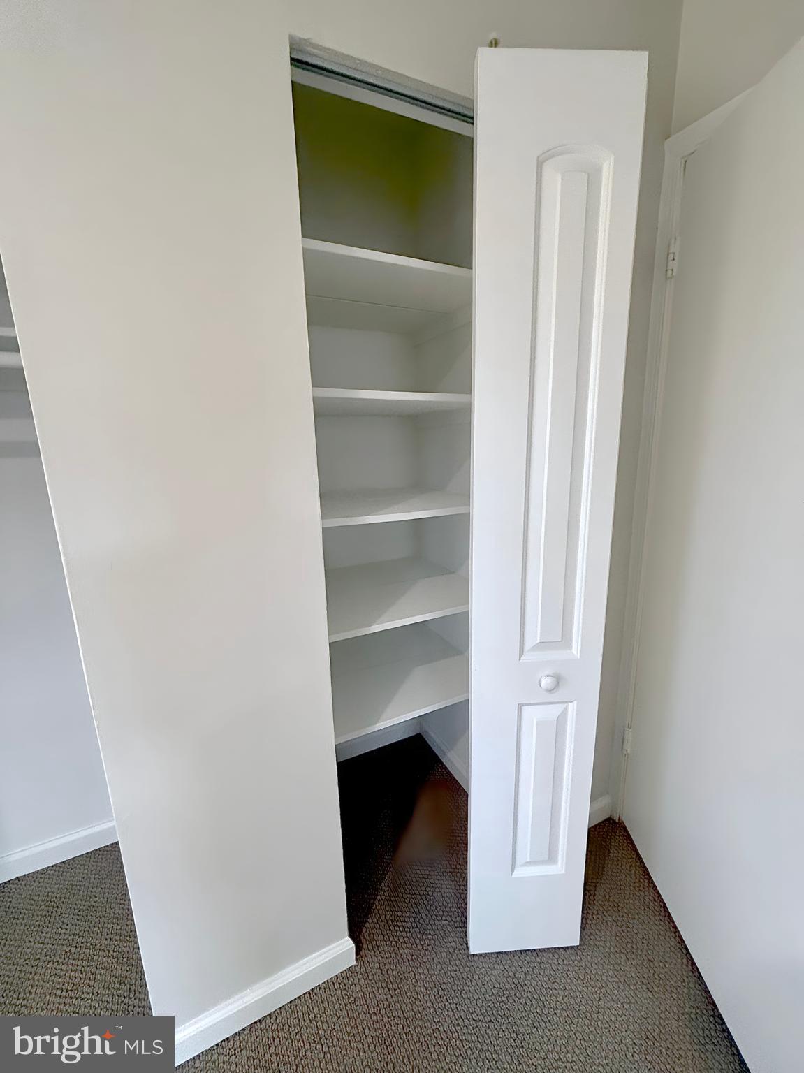 9278 Taney Road Manassas, VA 20110 - Photo 30 of 34 a view of walk in closet with empty racks