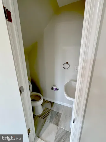 a bathroom with a sink and toilet