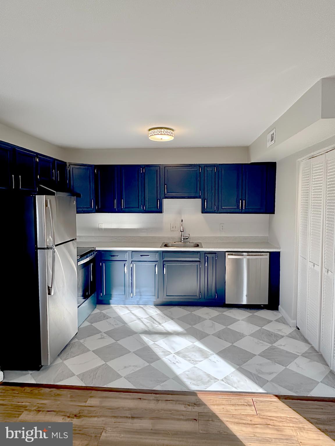 9278 Taney Road Manassas, VA 20110 - Photo 10 of 34 a kitchen with stainless steel appliances granite countertop a refrigerator a sink and a stove