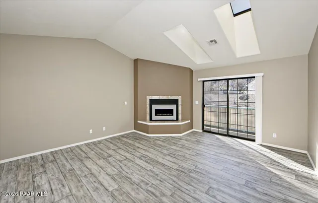 a view of a kitchen with a sink and a window