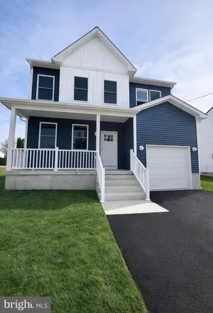 a view of a house with a yard and deck