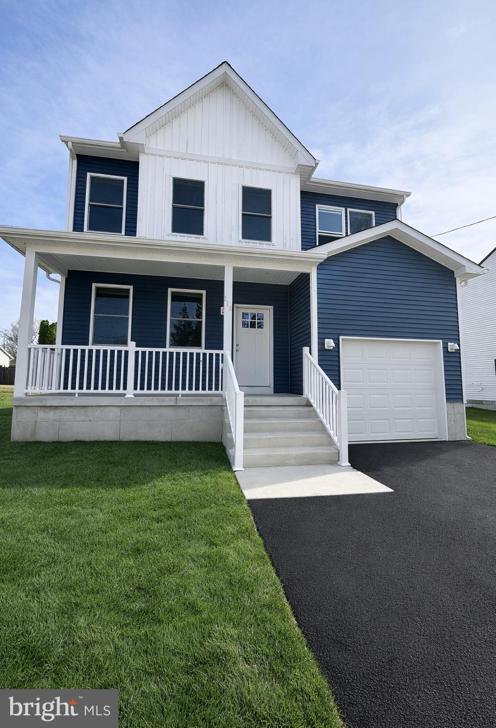 a view of a house with a yard and deck