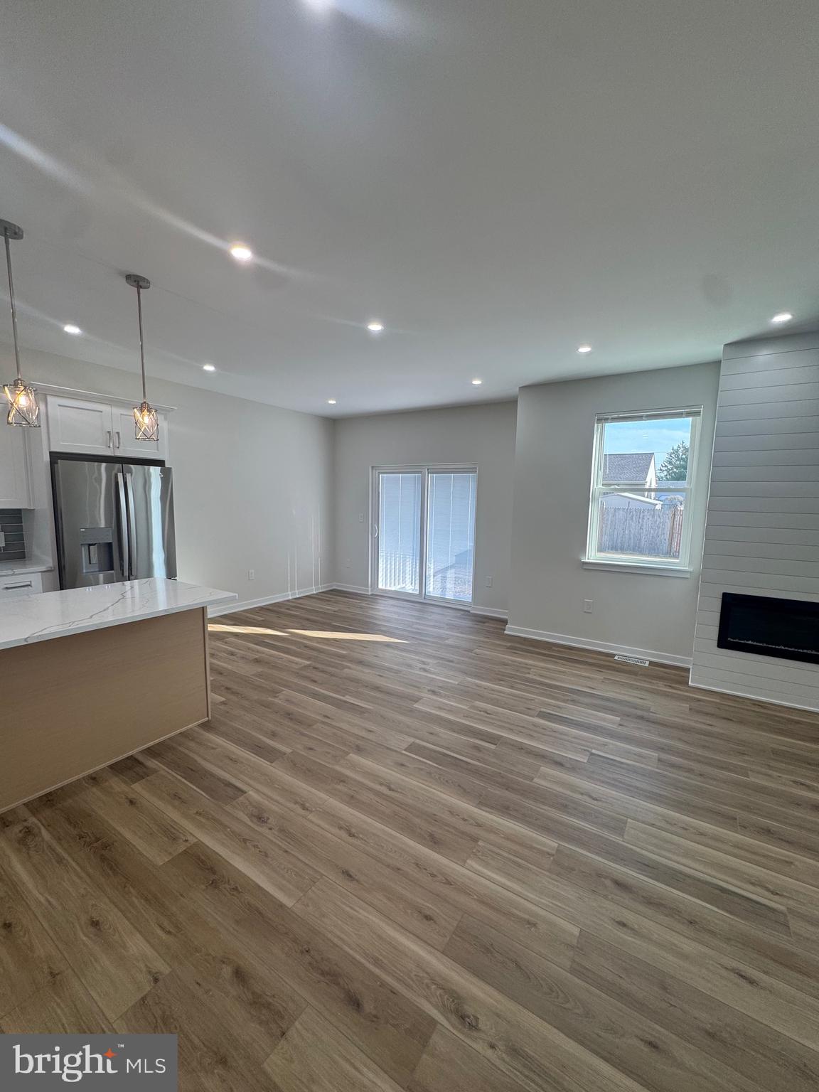 229 Ridge Avenue Blackwood, NJ 08012 - Photo 13 of 24 a view of an empty room with wooden floor and a window