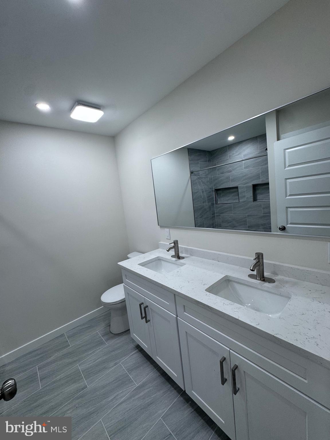 229 Ridge Avenue Blackwood, NJ 08012 - Photo 17 of 24 a bathroom with a double vanity sink and a mirror