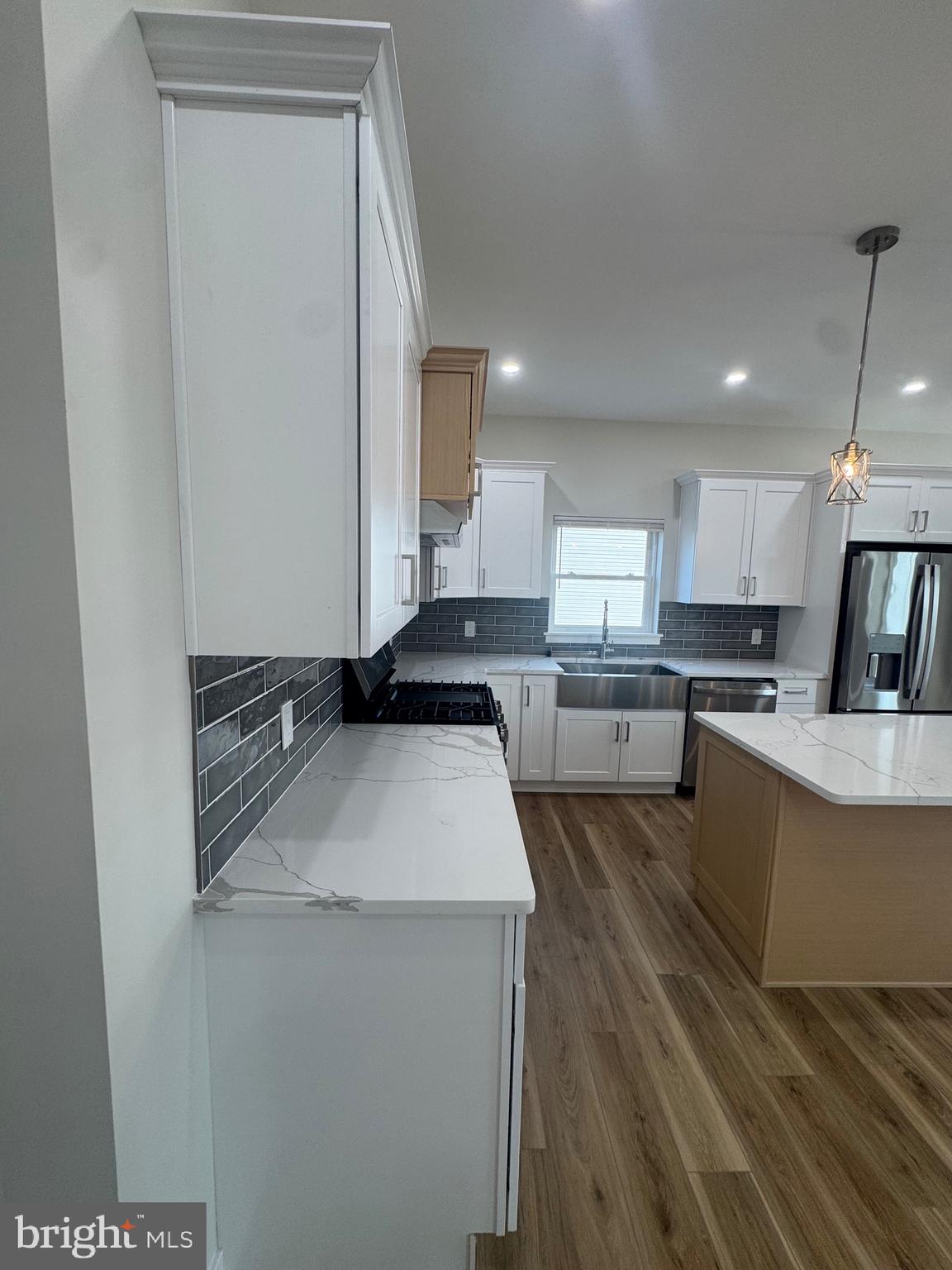 229 Ridge Avenue Blackwood, NJ 08012 - Photo 5 of 24 a large white kitchen with sink stove and refrigerator
