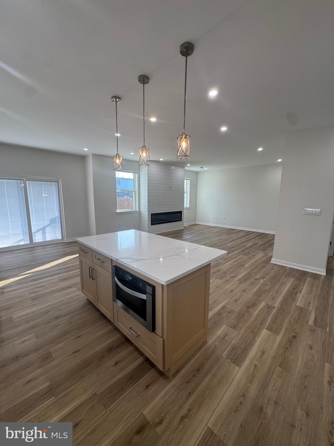 229 Ridge Avenue Blackwood, NJ 08012 - Photo 6 of 24 a kitchen with a stove and a wooden floor