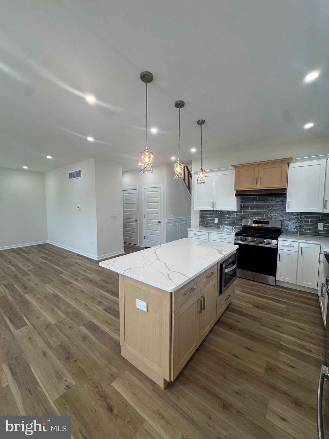 229 Ridge Avenue Blackwood, NJ 08012 - Photo 7 of 24 a large kitchen with stainless steel appliances granite countertop a large kitchen island a stove a refrigerator a sink and a oven