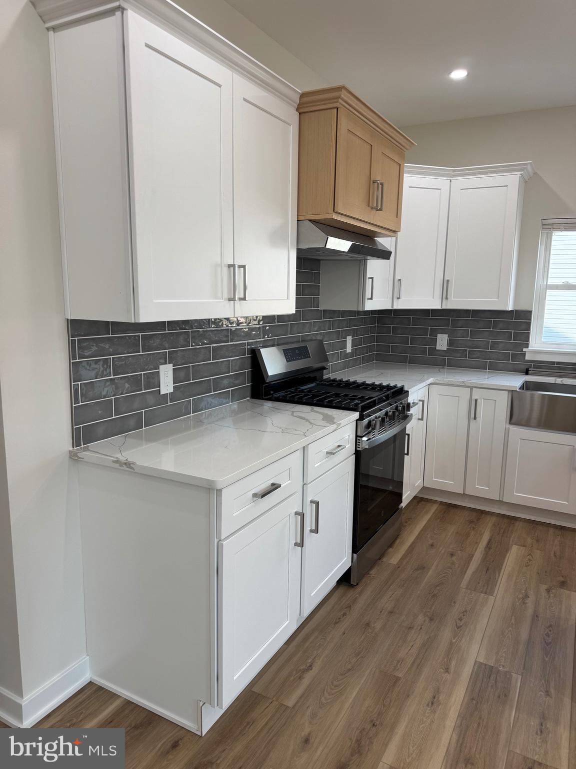 229 Ridge Avenue Blackwood, NJ 08012 - Photo 8 of 24 a kitchen with stainless steel appliances granite countertop a stove a sink and a microwave
