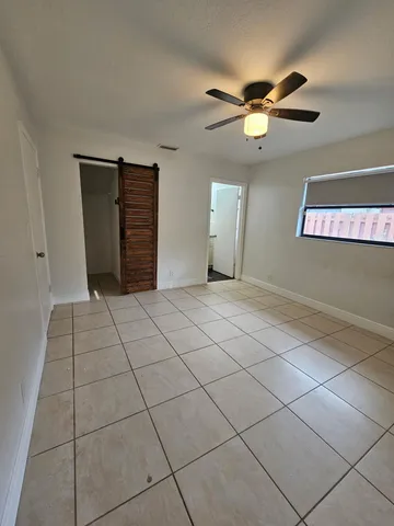 a view of an empty room and window