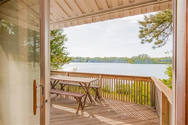 242 Barker Road Wareham, MA 02538 - Photo 14 of 30 a view of a lake with couches and wooden floor