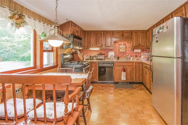 242 Barker Road Wareham, MA 02538 - Photo 6 of 30 a kitchen with stainless steel appliances granite countertop a sink a stove and a refrigerator