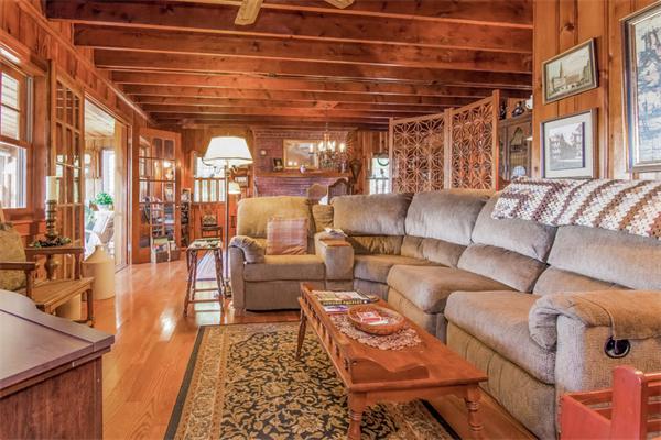 242 Barker Road Wareham, MA 02538 - Photo 7 of 30 a living room with furniture and a chandelier