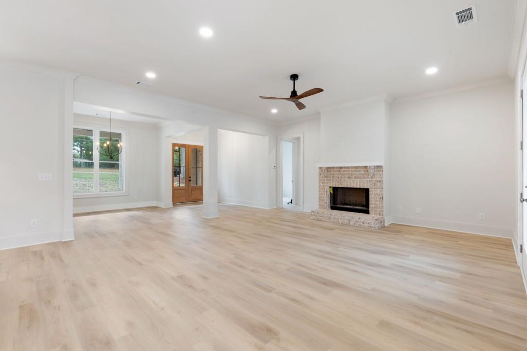 2001 Epperson Road Canton, GA 30115 - Photo 11 of 76 a view of an empty room with a fireplace and a window