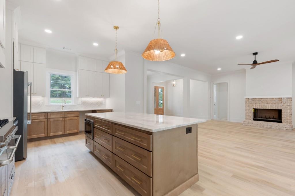 2001 Epperson Road Canton, GA 30115 - Photo 15 of 76 a kitchen with a stove and a wooden floor