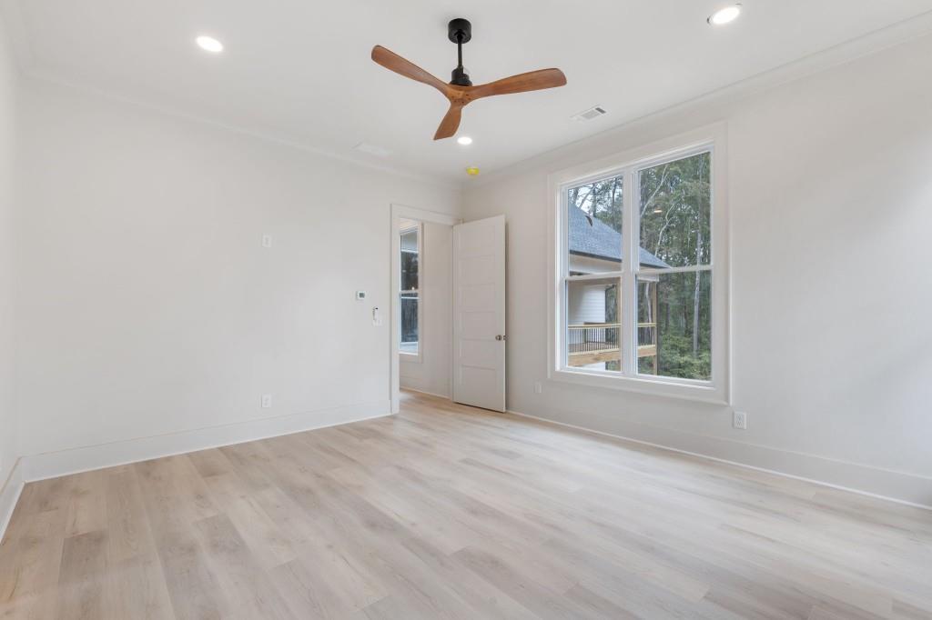2001 Epperson Road Canton, GA 30115 - Photo 27 of 76 an empty room with a window and a ceiling fan