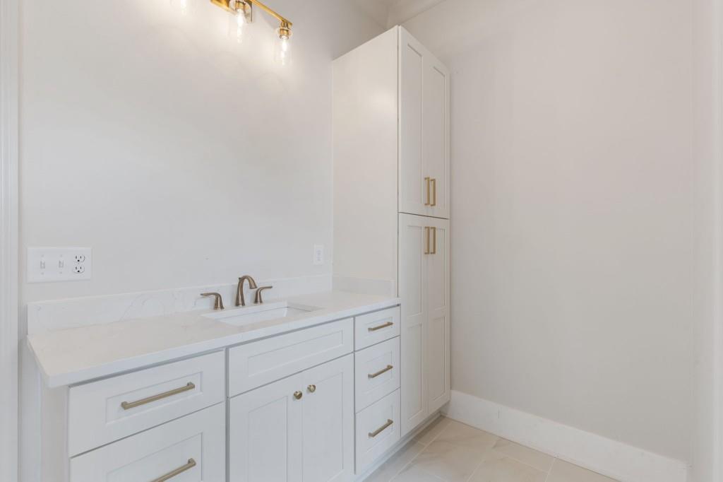 2001 Epperson Road Canton, GA 30115 - Photo 30 of 76 a bathroom with a sink and a mirror