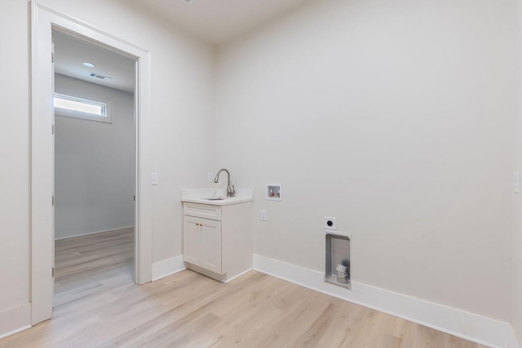 2001 Epperson Road Canton, GA 30115 - Photo 35 of 76 a hallway with a sink and a mirror