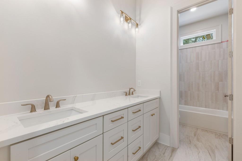 2001 Epperson Road Canton, GA 30115 - Photo 38 of 76 a bathroom with a sink and a shower