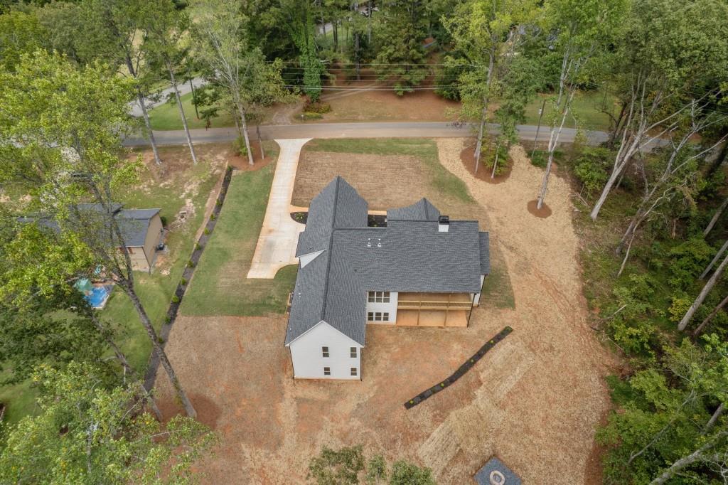 2001 Epperson Road Canton, GA 30115 - Photo 65 of 76 an aerial view of a house with swimming pool and large trees