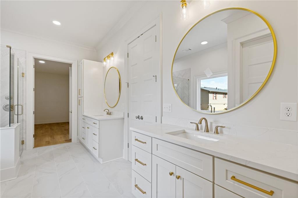 2001 Epperson Road Canton, GA 30115 - Photo 74 of 76 a spacious bathroom with a double vanity sink and a mirror