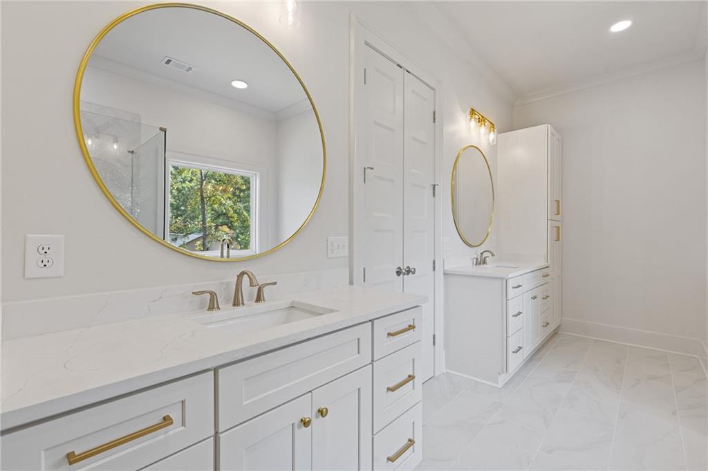 2001 Epperson Road Canton, GA 30115 - Photo 75 of 76 a bathroom with a sink a mirror a vanity and a mirror