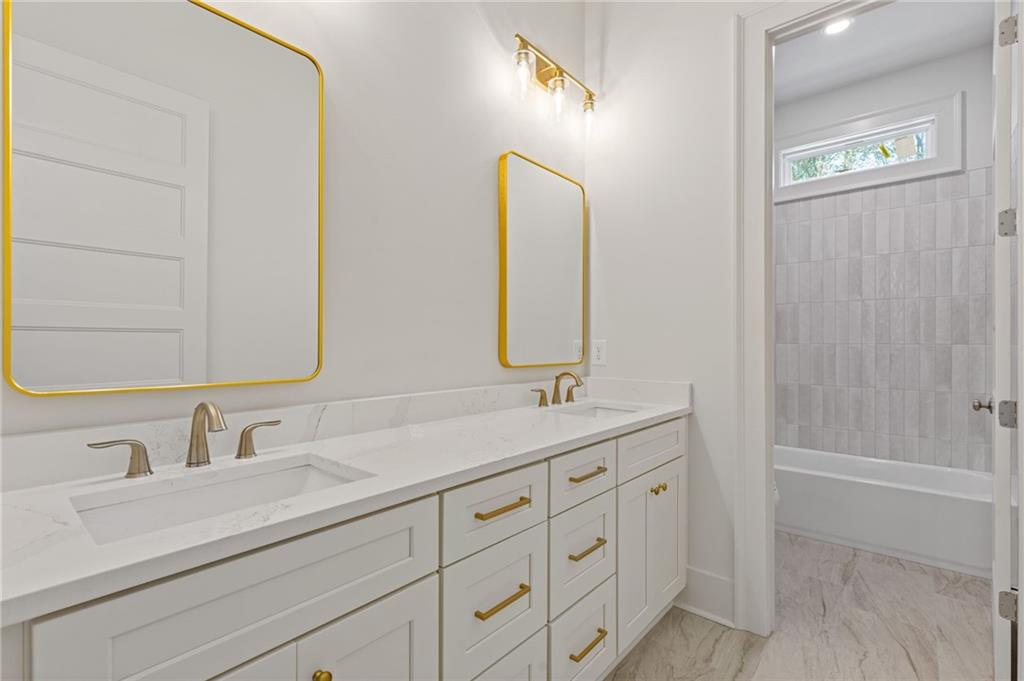 2001 Epperson Road Canton, GA 30115 - Photo 76 of 76 a bathroom with a double vanity sink and a mirror