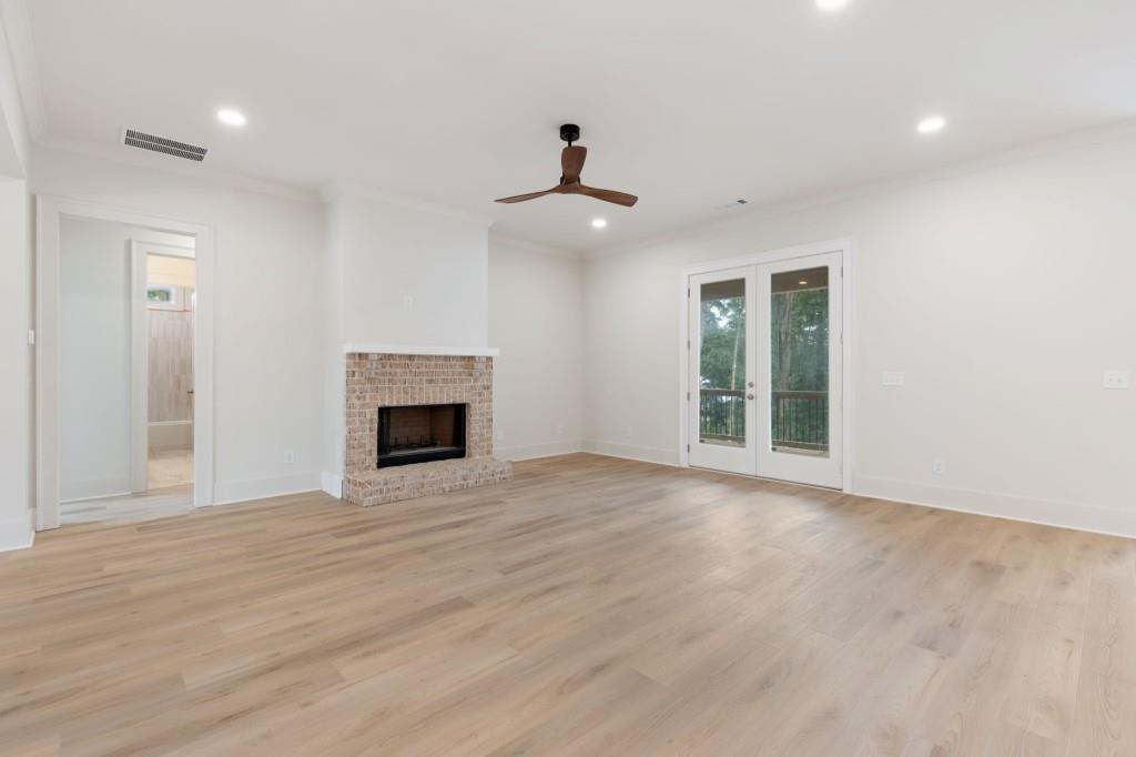 2001 Epperson Road Canton, GA 30115 - Photo 10 of 76 an empty room with windows and a fireplace