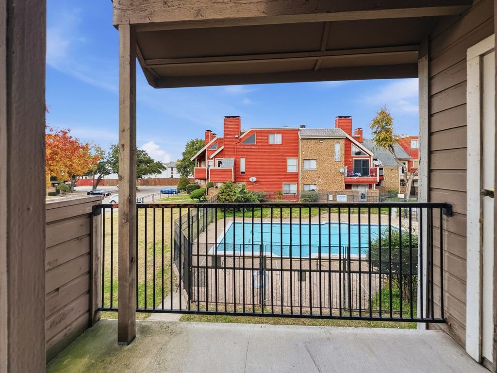 9835 Walnut Street, Unit 208 Dallas, TX 75243 - Photo 12 of 13 a view of a balcony with city view