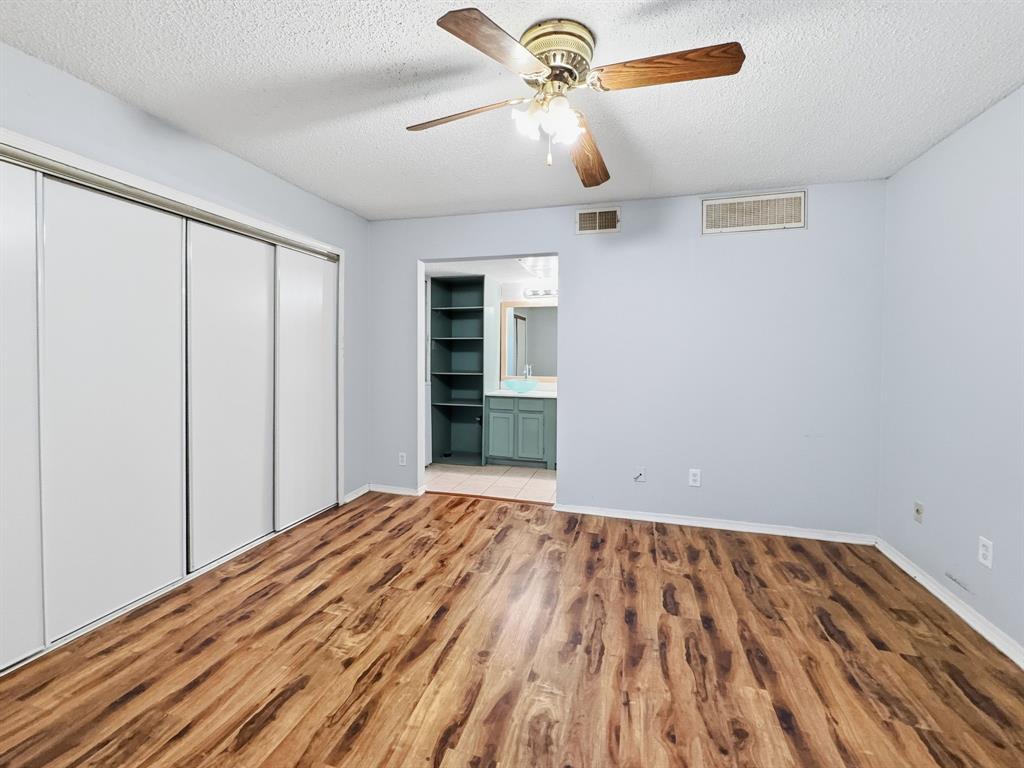9835 Walnut Street, Unit 208 Dallas, TX 75243 - Photo 4 of 13 a view of empty room with wooden floor