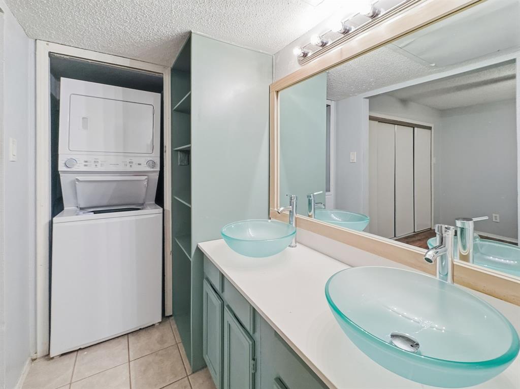 9835 Walnut Street, Unit 208 Dallas, TX 75243 - Photo 5 of 13 a bathroom with a sink and a mirror