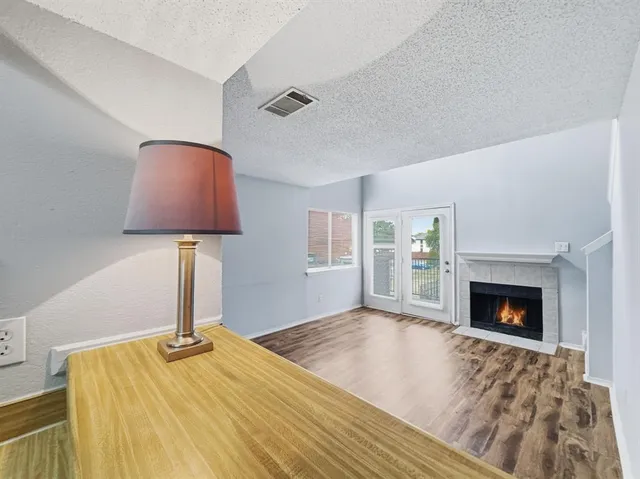 a bedroom with a bed and a fireplace