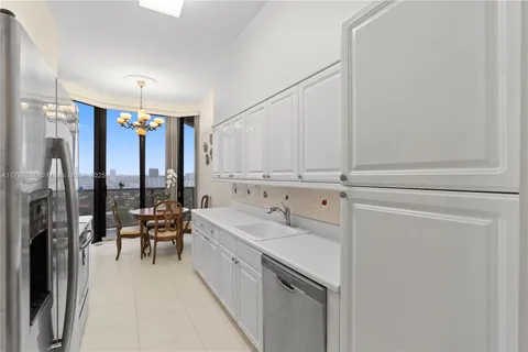 a spacious bathroom with a bathtub shower sink mirror and toilet
