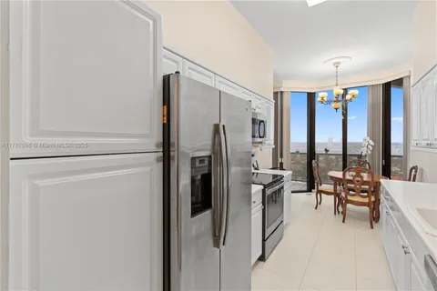 a spacious bathroom with a double vanity sink mirror and toilet