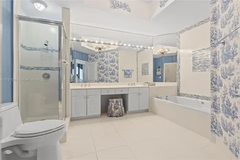 a bathroom with a double vanity sink mirror double and shower