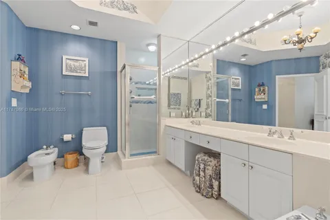 a bedroom with a bed and a flat tv screen on the table