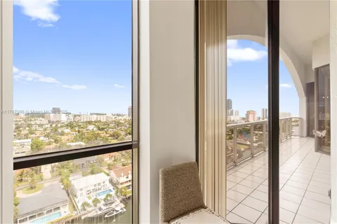 an aerial view of residential building with outdoor space and lake view