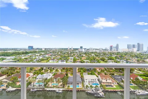 a kitchen with sink and refrigerator