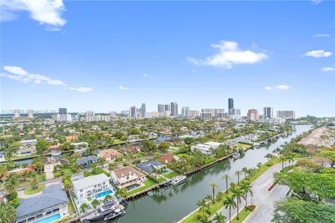 a view of a swimming pool with a yard